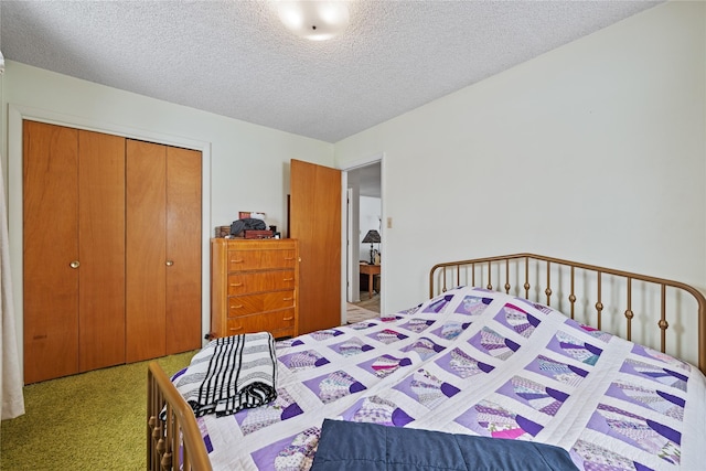 bedroom with light colored carpet, a closet, and a textured ceiling