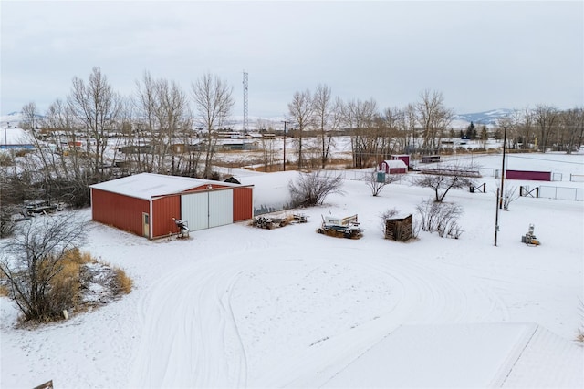 yard covered in snow with a mountain view