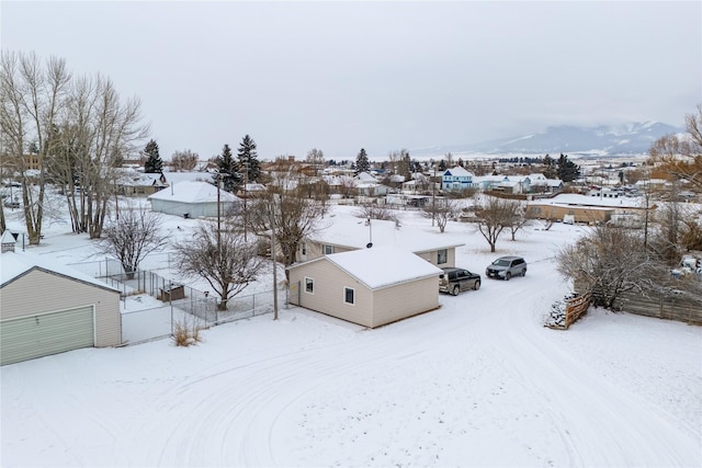 snowy aerial view featuring a mountain view