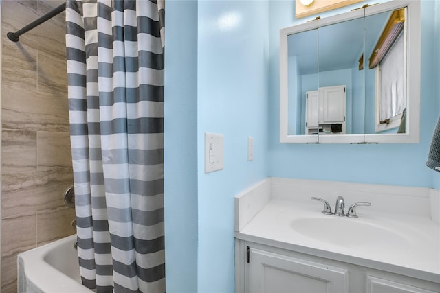 bathroom with shower / bathtub combination with curtain and vanity