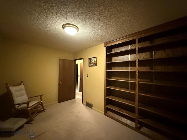 3435 Parkway St, Butte, MT 59701 - living area featuring baseboards, a textured ceiling, visible vents, and carpet