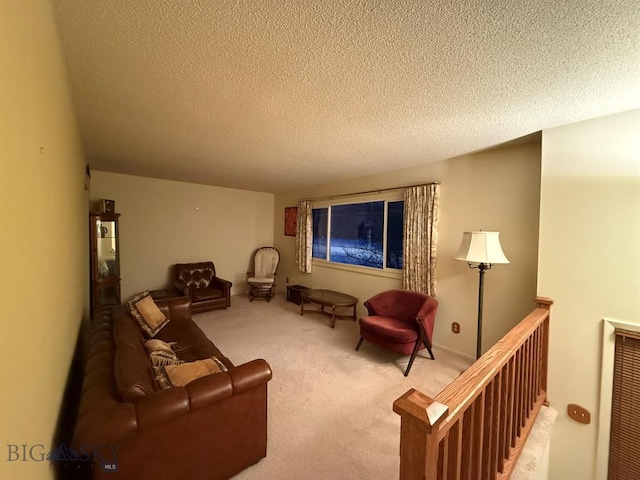 living room featuring light carpet and a textured ceiling