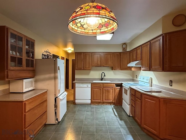 3435 Parkway St, Butte, MT 59701 - kitchen featuring brown cabinets, under cabinet range hood, a sink, white appliances, and glass insert cabinets