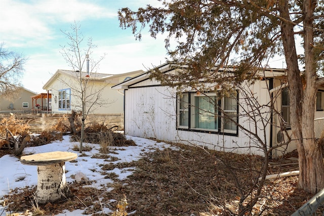 view of snow covered property