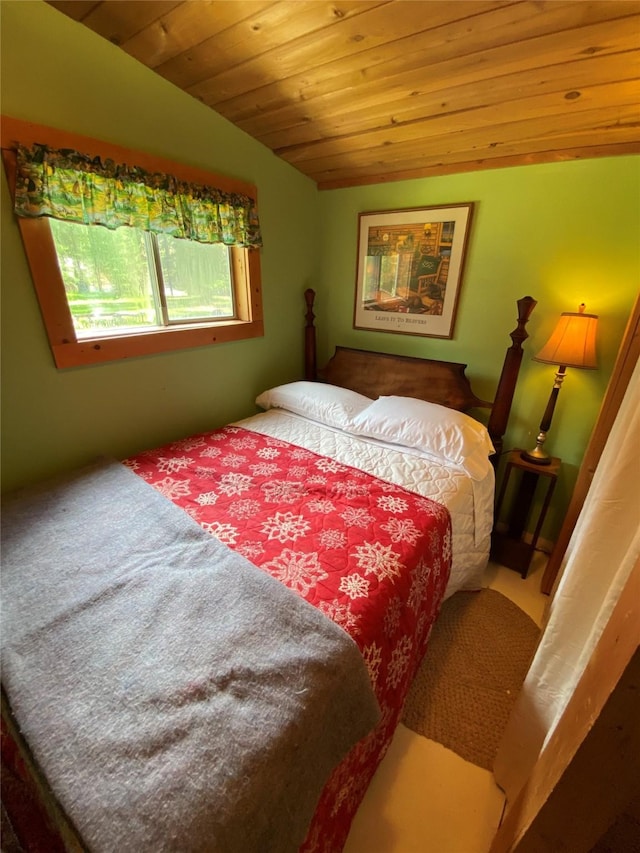 bedroom with lofted ceiling and wooden ceiling