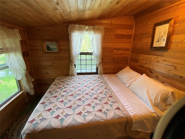 bedroom featuring lofted ceiling, wood ceiling, and wood walls