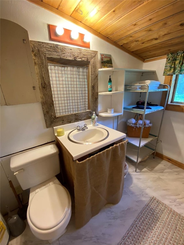 bathroom featuring vanity, lofted ceiling, wooden ceiling, and toilet