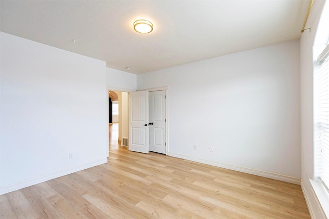 empty room with light wood-type flooring