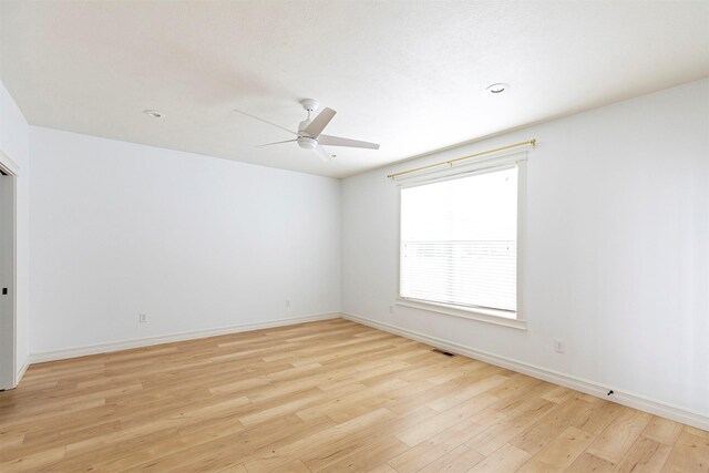 unfurnished room featuring ceiling fan and light hardwood / wood-style flooring