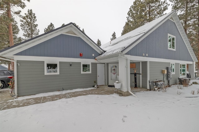 view of snow covered house