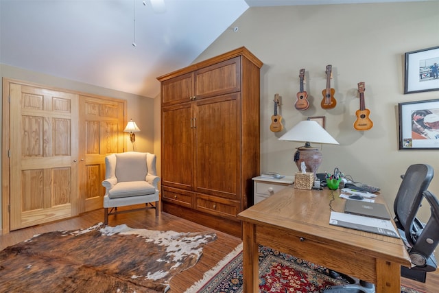 office area featuring wood finished floors and lofted ceiling