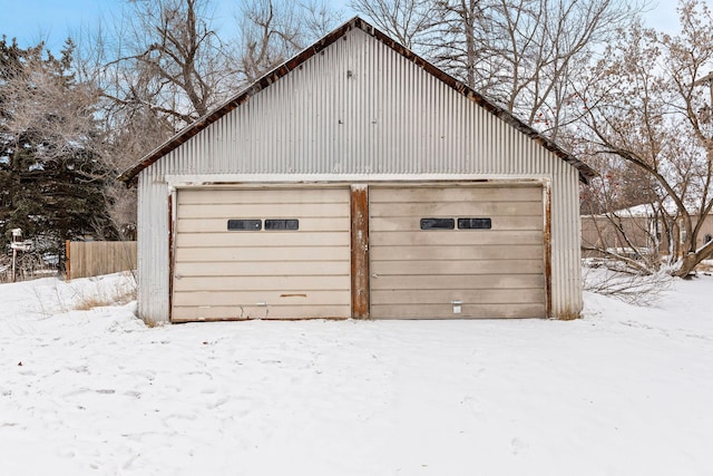 view of snow covered garage