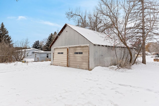 view of snow covered garage