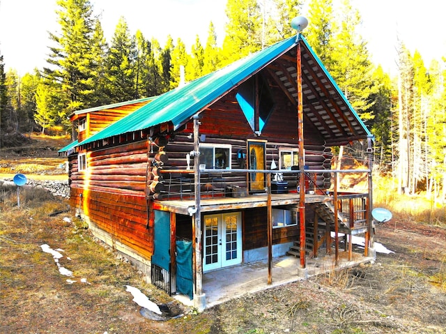 exterior space featuring french doors, a deck, and a patio area