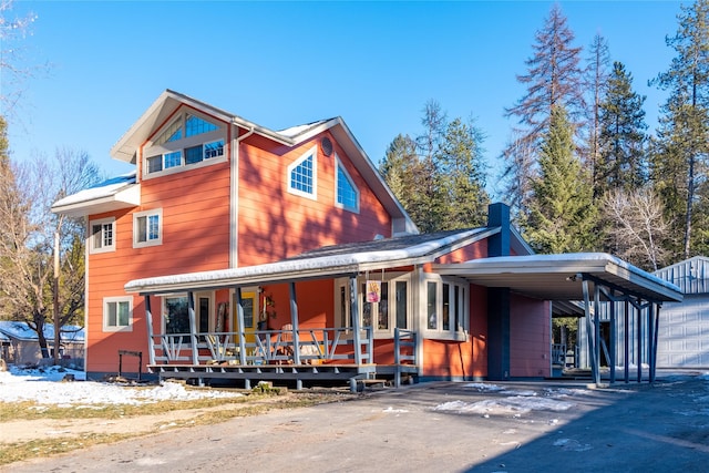 exterior space featuring a carport and covered porch