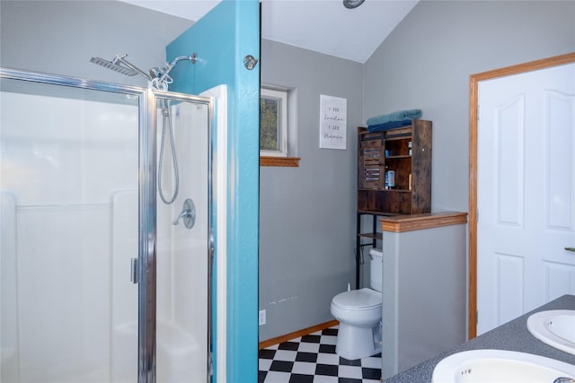 bathroom with toilet, lofted ceiling, vanity, and walk in shower