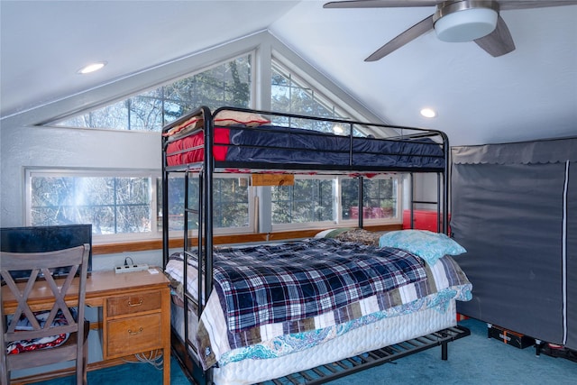 bedroom with multiple windows, carpet floors, vaulted ceiling, and ceiling fan