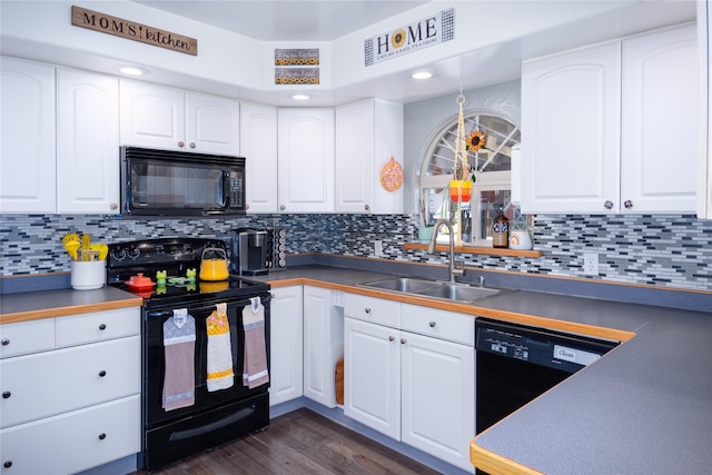 kitchen with sink, dark wood-type flooring, white cabinetry, tasteful backsplash, and black appliances