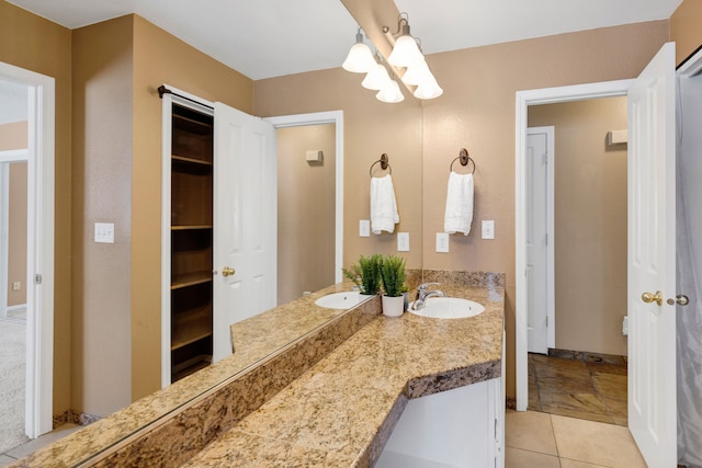 bathroom featuring vanity and tile patterned flooring