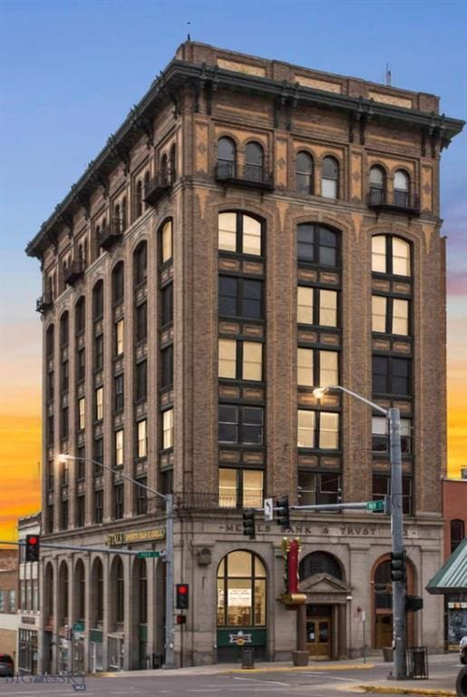 view of outdoor building at dusk