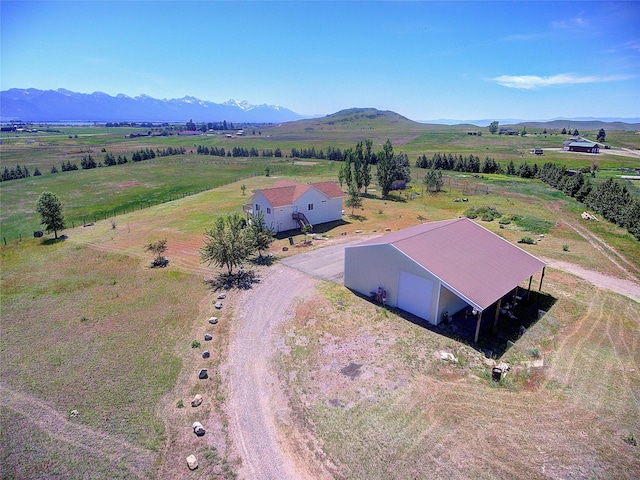 birds eye view of property featuring a rural view and a mountain view