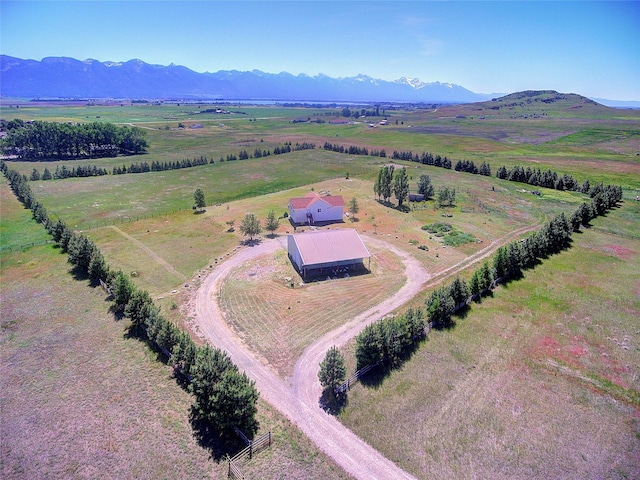 drone / aerial view featuring a rural view and a mountain view