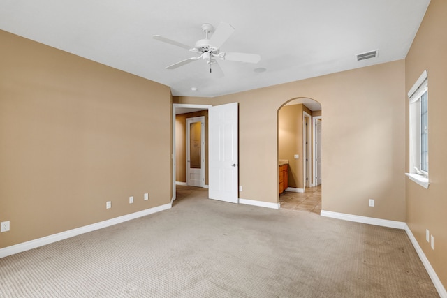 interior space featuring light colored carpet and ceiling fan