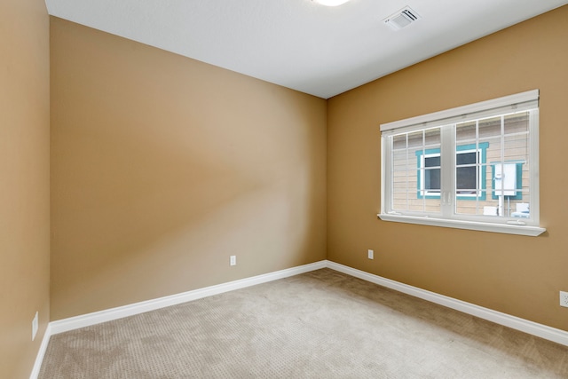 unfurnished room with carpet floors