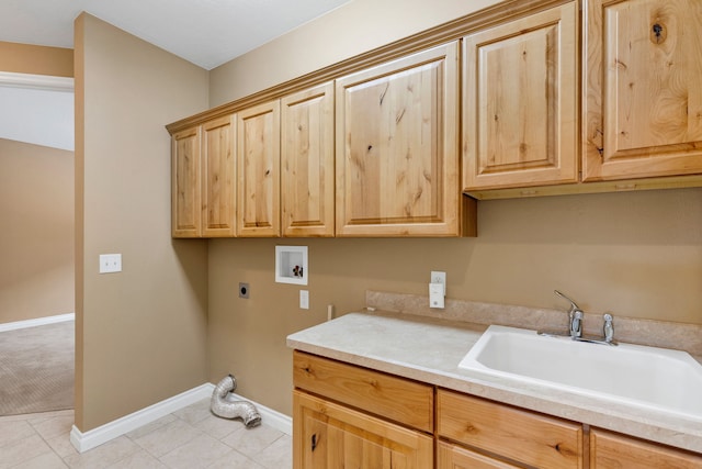 laundry room with sink, cabinets, light tile patterned floors, electric dryer hookup, and washer hookup