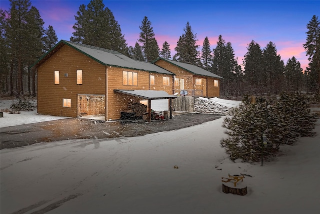 view of back house at dusk