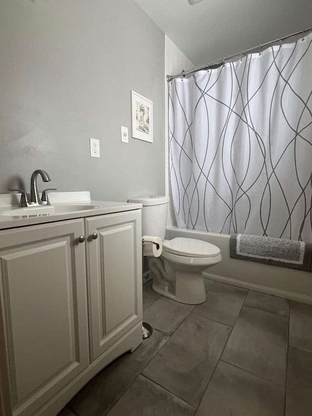 full bathroom featuring vanity, shower / bathtub combination with curtain, and toilet