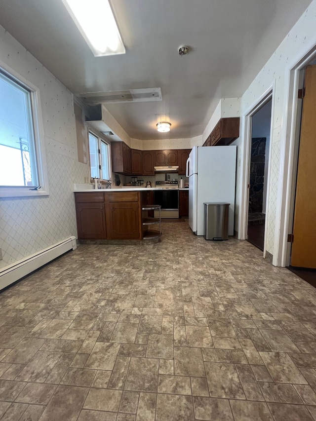 kitchen featuring white refrigerator, stove, a baseboard heating unit, and dark brown cabinetry