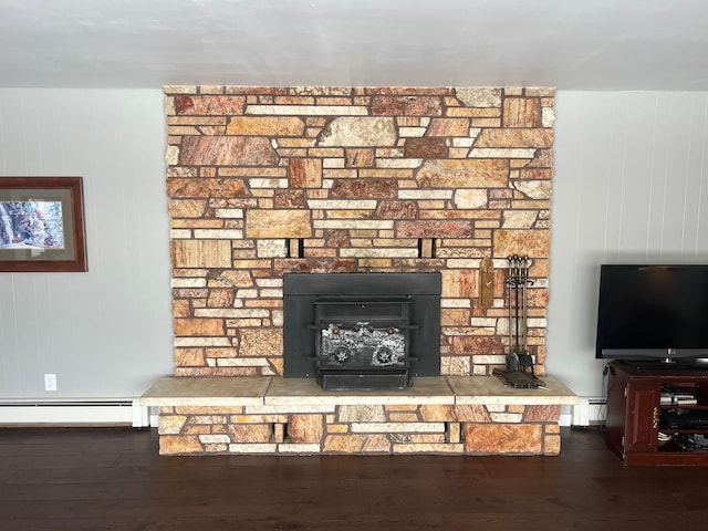 room details with hardwood / wood-style flooring and a baseboard heating unit