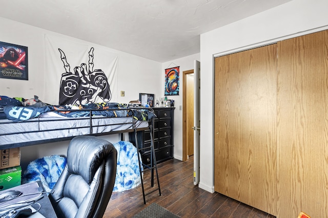 bedroom with dark wood-type flooring