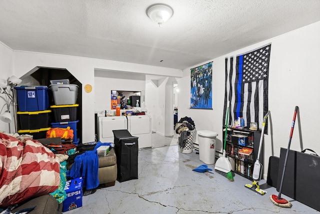 basement featuring independent washer and dryer and a textured ceiling