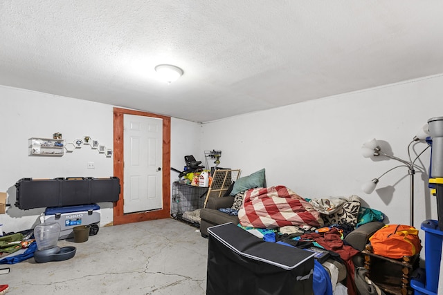 interior space featuring concrete flooring and a textured ceiling