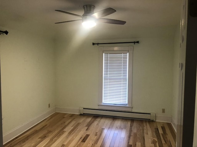 empty room featuring baseboards, ceiling fan, light wood-style flooring, and baseboard heating