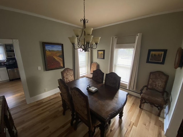 dining room featuring light wood-type flooring, an inviting chandelier, a baseboard radiator, and ornamental molding