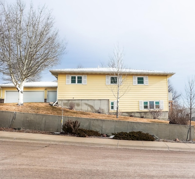 view of property exterior with a garage