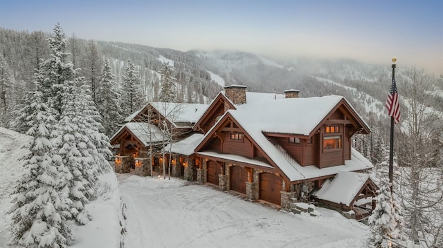 log home featuring a garage