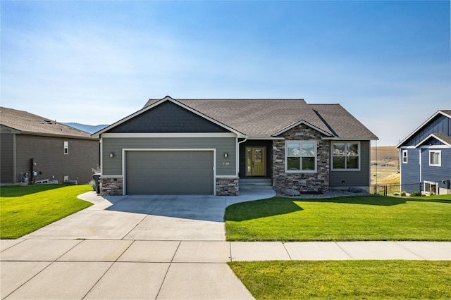 craftsman inspired home featuring a garage and a front lawn