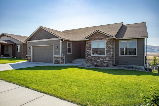 view of front of property with a garage and a front yard