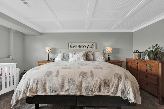 bedroom with dark colored carpet