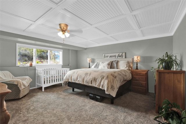 carpeted bedroom with coffered ceiling and ceiling fan