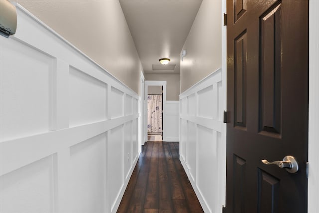 corridor featuring dark wood-type flooring