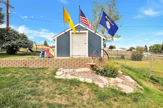 view of outdoor structure featuring a lawn