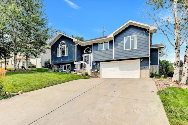 bi-level home featuring a garage and a front yard