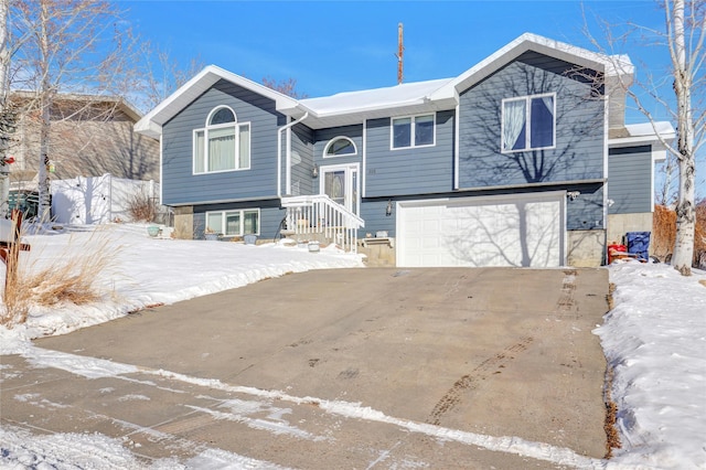 raised ranch featuring a garage