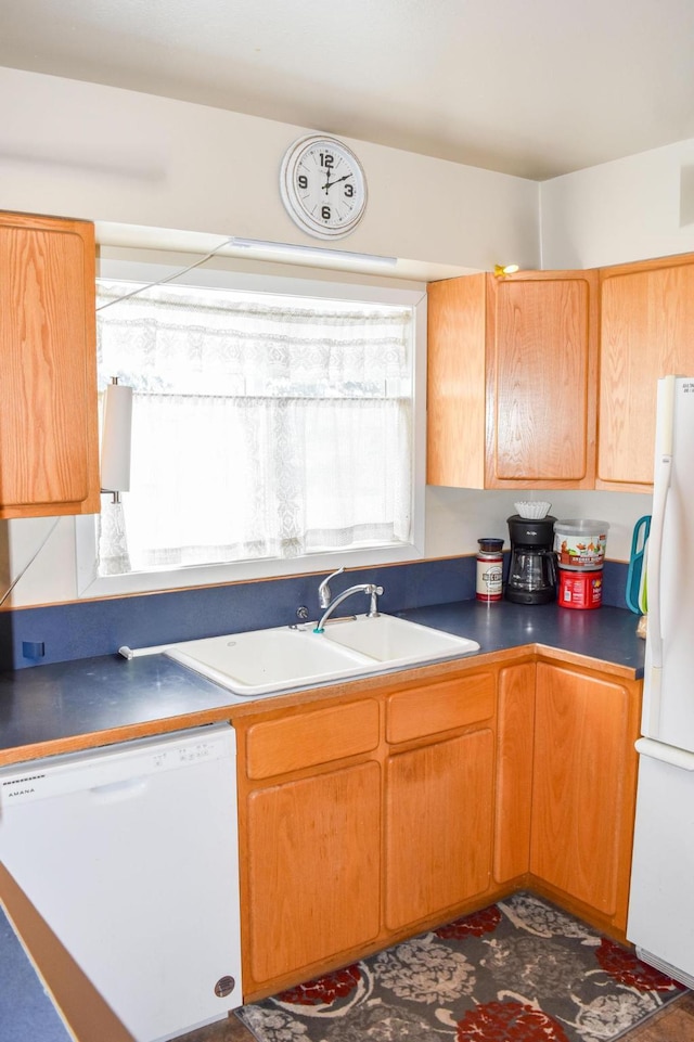 35011 Little Marten Rd, Ronan, MT 59864 - kitchen with white appliances, a sink, and dark countertops