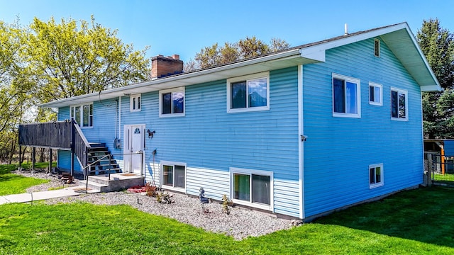 35011 Little Marten Rd, Ronan, MT 59864 - rear view of property with a chimney, a lawn, and stairway